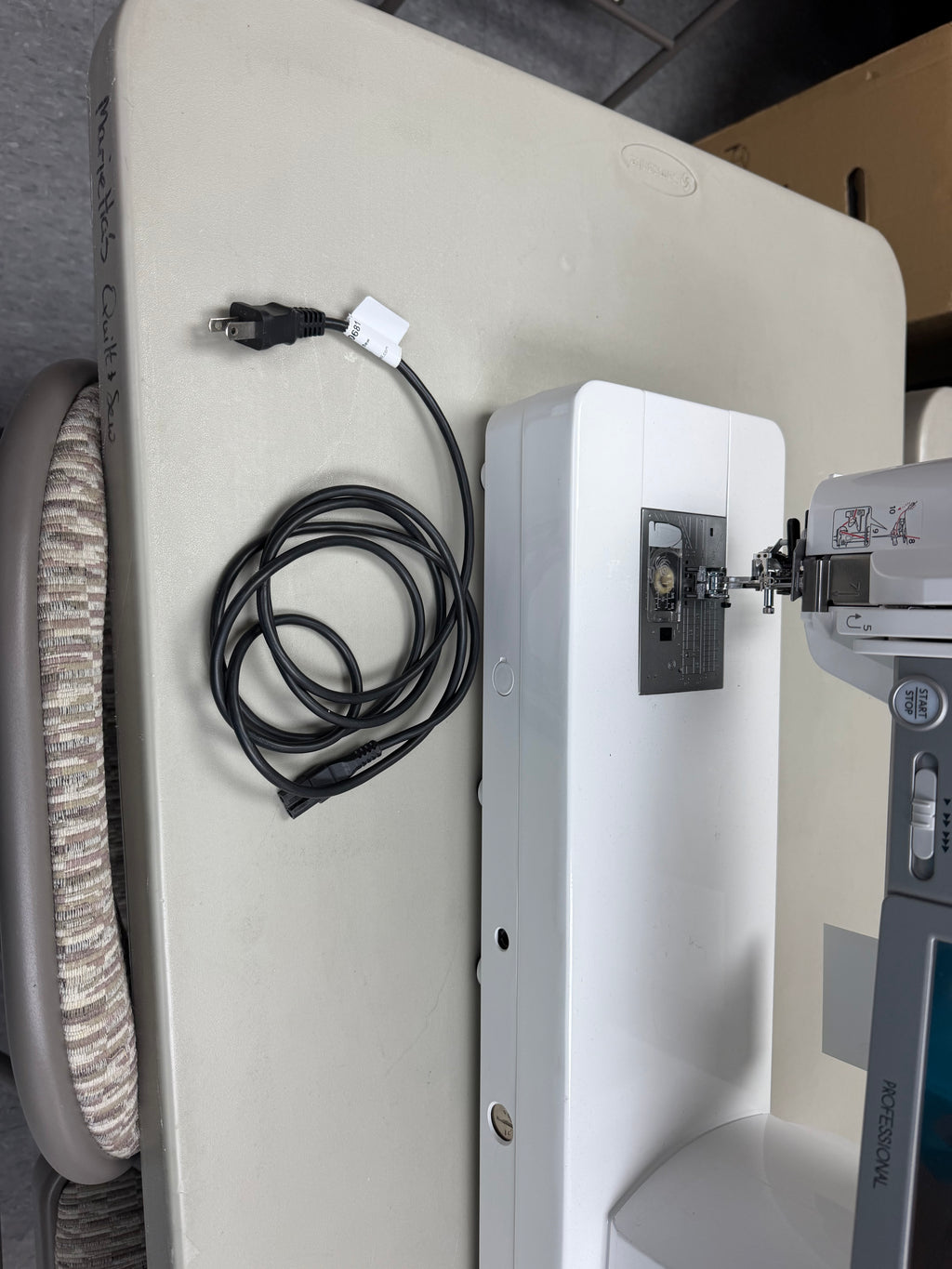 Needle plate and power cord